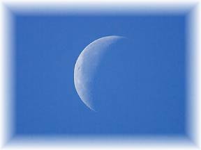 Pale Moon in Blue Sky