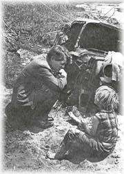 Robert Kennedy talks to a poor child.