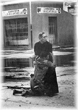 A Young Soldier, Shot by a Sniper in Spain, Clings to a Priest Before He Dies